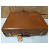 Vintage Samsonite suitcase full of adult