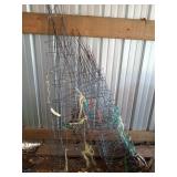 Two towers of 10+ tomato cages