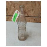 Old glass DeLicious soda bottle