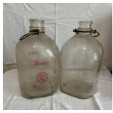 Two large Vintage Bordens glass milk jugs