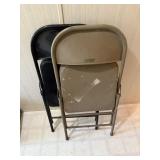 Two metal folding chairs