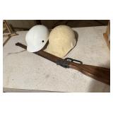 Two kids hardhats and a BB gun