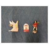 Two hard Rock Cafe pins, and one coca cola