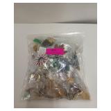 Mystery bag of costume jewelry, mostly brooches