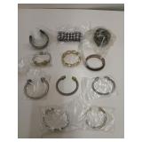 11 costume bracelets, mostly cuff-styled