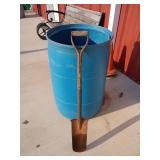 Plastic 55 gallon drum with Bill dookie shovel