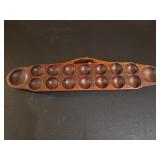 Sungka board, a traditional Filipino mancala g