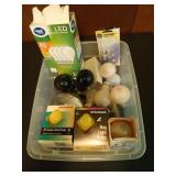Plastic tub of assorted light bulbs