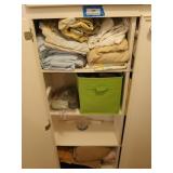 Contents of linen shelves, includes bedding,