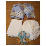 Assorted quilts, linens