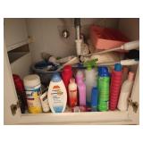 Bathroom contents: assorted towels, cleaners,