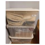 Three clear tubs of fabric