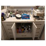 Bathroom contents: cleaners shampoos, body wash,