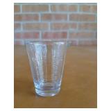 Tiny glass measuring cup