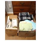 Two boxes of fabric remnants, includes some