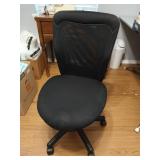 Black swivel office chair on wheels