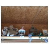 Left shelf above window full of trinkets and