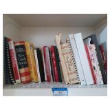 Shelf of cookbooks, dietary supplements,
