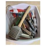 Bin of kitchen utensils inc meat tenderizer
