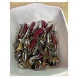 Bin of two styles of silverware