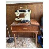Sewing machine and sewing table