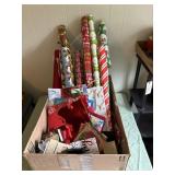 Box of wrapping paper, gift bags, and gift boxes