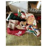 Bin of Christmas decor, stockings, tablecloths
