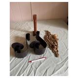 Two black metal wall hanging candle holders, a