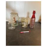 Decorative glassware; including a red bottle with