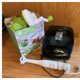 George Foreman grill, a super slicer and a hand