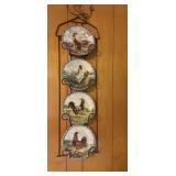 Decorative Rooster plates on a metal wall hanger