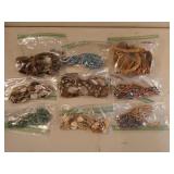 12 baggies of costume jewelry, mostly