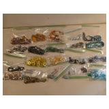 20 bags of assorted costume jewelry, mostly