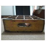 Half of a wooden Dr pepper soda crate