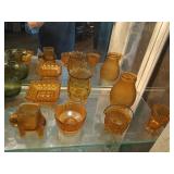 Shelf contents: brown / amber glass