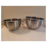 2 stainless colanders 10" - 11"; big one is