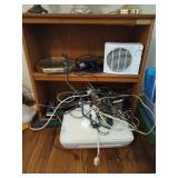 Shelf and contents: fan, wall clock, printer,