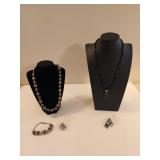 Two sets of jewelry, both marked 925. Purple set