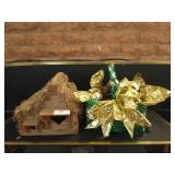 Wooden birdhouse, basket of pine cones and