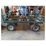 Oversized garden cart with drop-down sides, has a