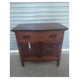 Antique oak cabinet on wood casters 29.5 x 30 x 17