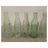 5 old soda bottles
