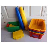 Colorful bins, two giant plastic crayons, and a