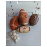 Four old footballs and some whiffle golf balls