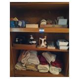 Bathroom cabinet contents: jewelry cleaner, hair