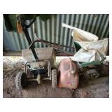 Two seed spreaders, about a fourth a bag of