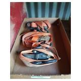 Three orange tie-down straps