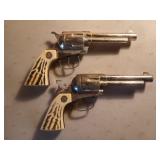 2 Nichols cap guns, 1 needs repaired