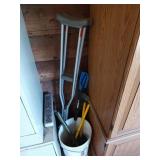 A bucket of fun things, includes crutches, bike