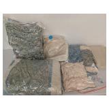 Bedding set in vacuum bags in plastic tote with